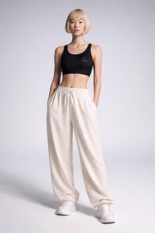 Full body view of the model wearing Women’s Black Sports Bra — ‘Civil Risk’ Lightweight Racerback Activewear